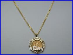 14K solid gold pendant with a 21.6 K gold coin