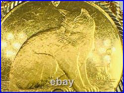 1990 Isle of Man NY Alloy Cat 999.0 gold coin in 14K rope bezel. 1 1/8.9.1gm